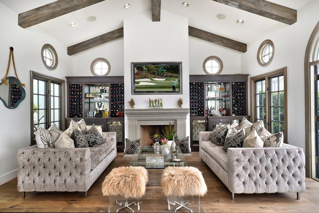 Living room with tufted sofas and exposed beams