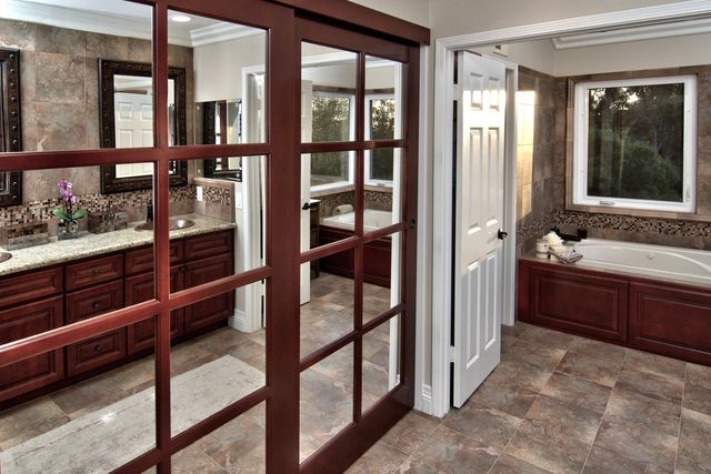 Bathroom with mirrored sliding doors