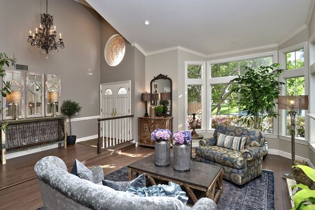 Living room with chandelier and window seating