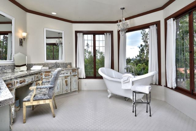 Bathroom with soaking tub and vanity