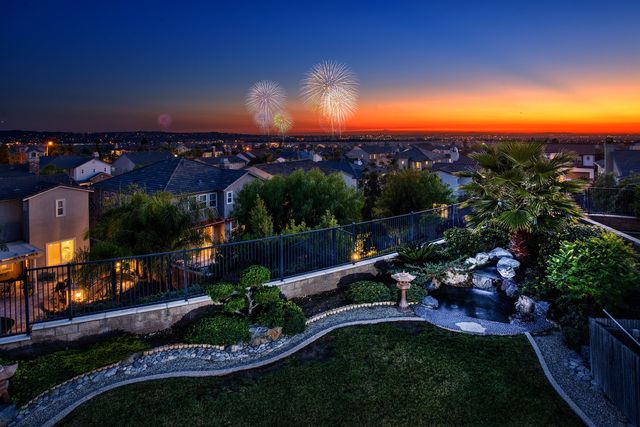 Backyard garden view at sunset with fireworks