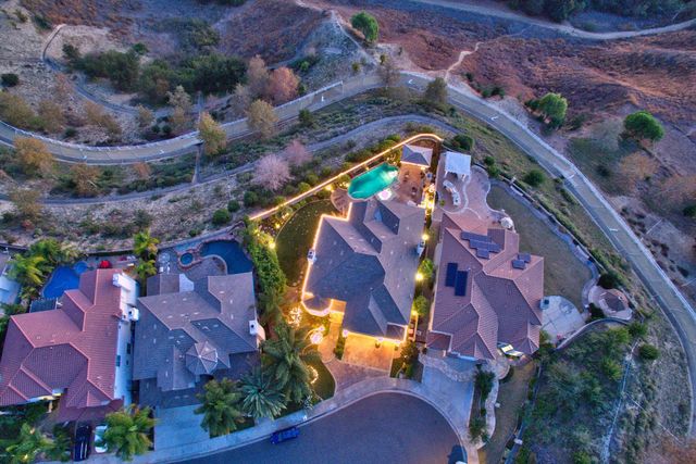 Aerial view of a hillside lot at dusk