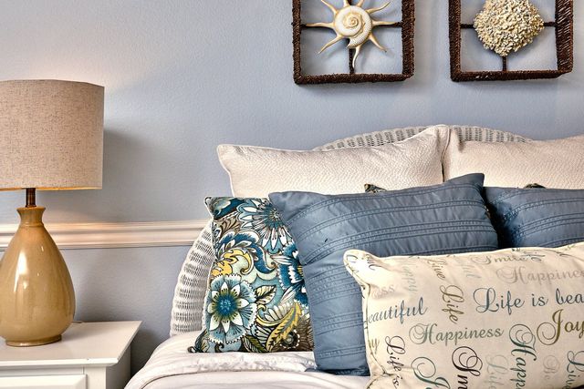 Bedroom with coastal-style pillows