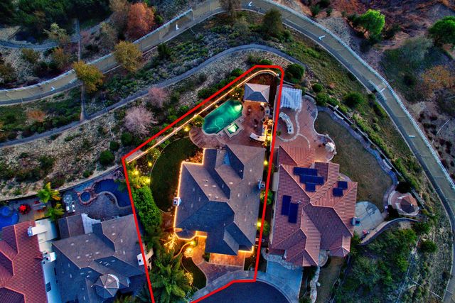 Aerial view of a property outlined in red
