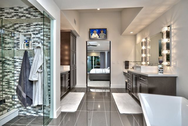 Bathroom with mosaic tile shower and soaking tub