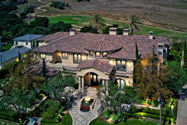 Aerial view of a Mediterranean estate with landscaped gardens