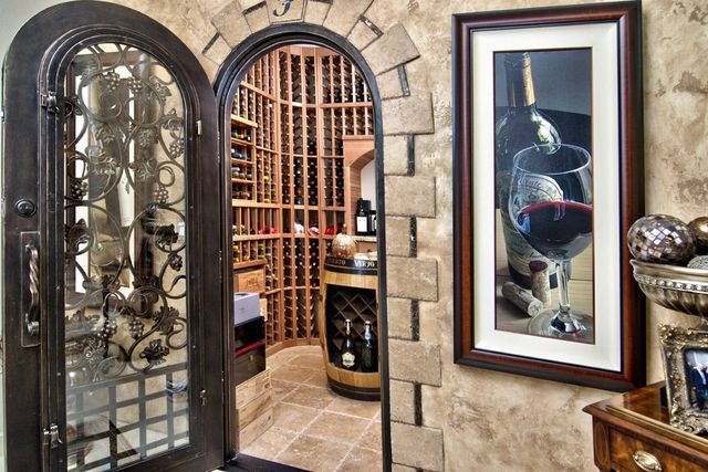 Wine cellar with wrought-iron door