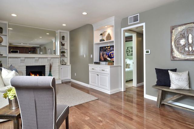 Living room with fireplace and hardwood floors