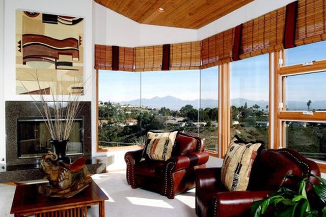 Living room with leather chairs and view windows