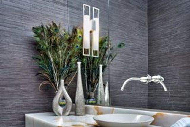 Wall-mounted bathroom sink on an onyx counter