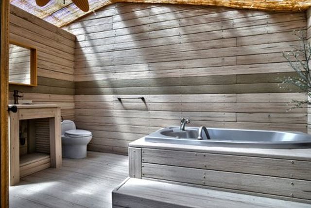 Bathroom with wood-paneled walls